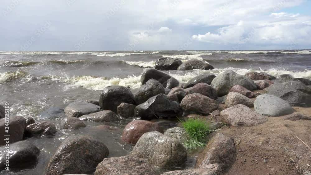 Slow Motion .Waves of the sea break against stones. Gulf of Finland Slow Motion .Waves of the sea break against stones. Gulf of Finland