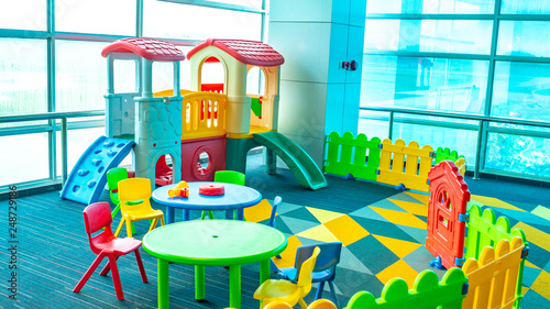 colorful playground facility near the windows. 