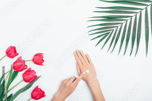 Female s hands put cosmetic cream