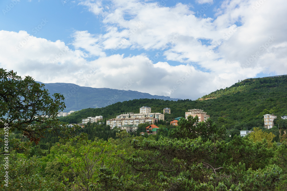 View of residential multi-storey old houses on a mountain slope in the village of Gaspra in the Crimea