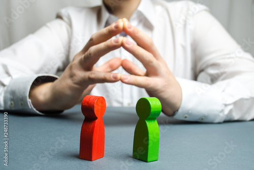 Фотография The arbitrator examines the conflict situation between people