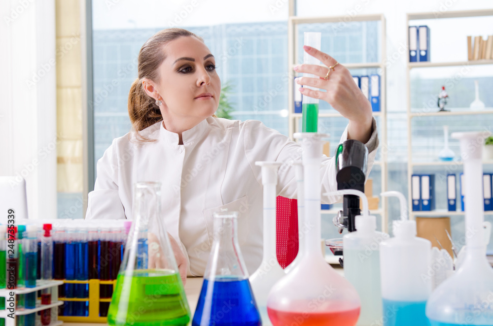 Female chemist working in medical lab Female chemist working in medical lab