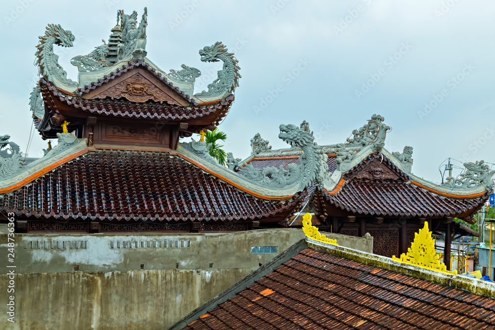 Chinese temple curved roof in dragon shape dragons. Chinese temple curved roof in dragon shape dragons.