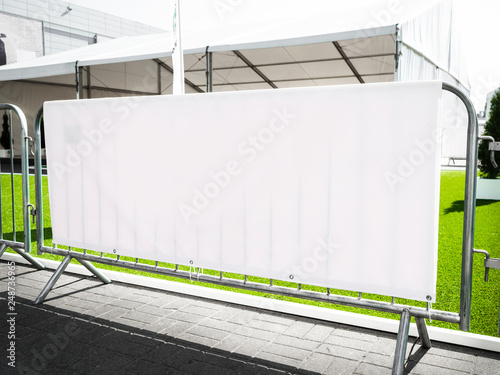 Layered Fabric Banner Mockup, vinyl banners printing, grommet mockup, Corporate outdoor banner, Horizontal Banner Mockup Hanging Outside. Fabric & Scrim Vinyl Banner hanging on the fence.