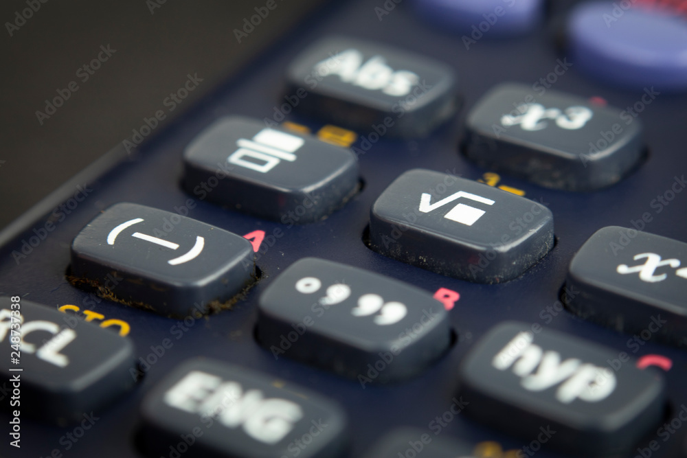 Closeup or macro photo of the scientific calculator buttons. Keys include the mathematical terms. Numerical operation concept. Closeup or macro photo of the scientific calculator buttons. Keys include the mathematical terms. Numerical operation concept.