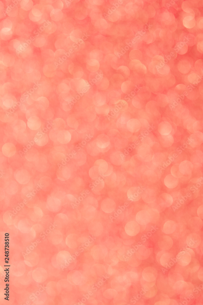 Abstrast blurred glittery shiny background, coral, colur of the year 2019