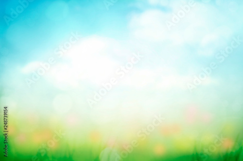 abstract nature spring background with green grass and blue sky gradient