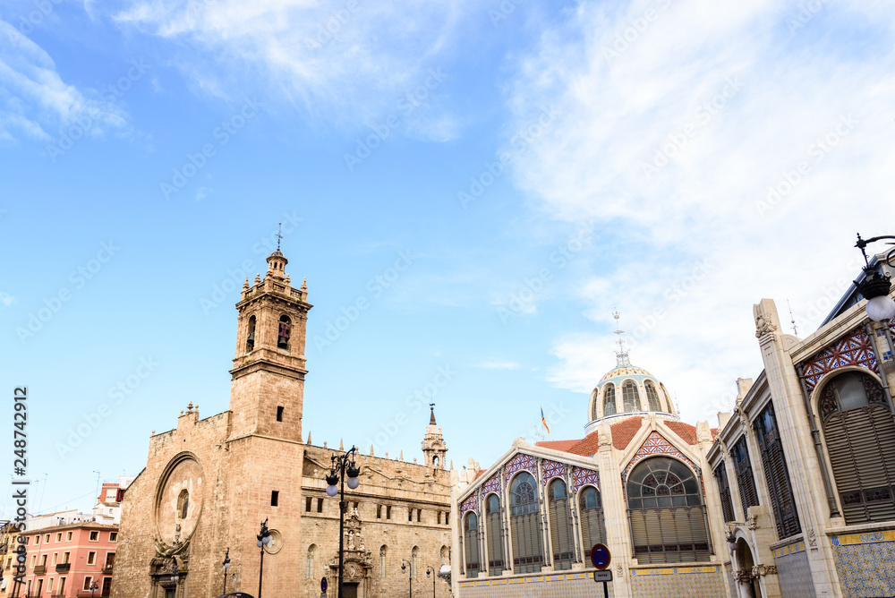 Exterior of tourist places in Valencia, Ciudad of Brujas square, with the central market and the church of Santos Juanes