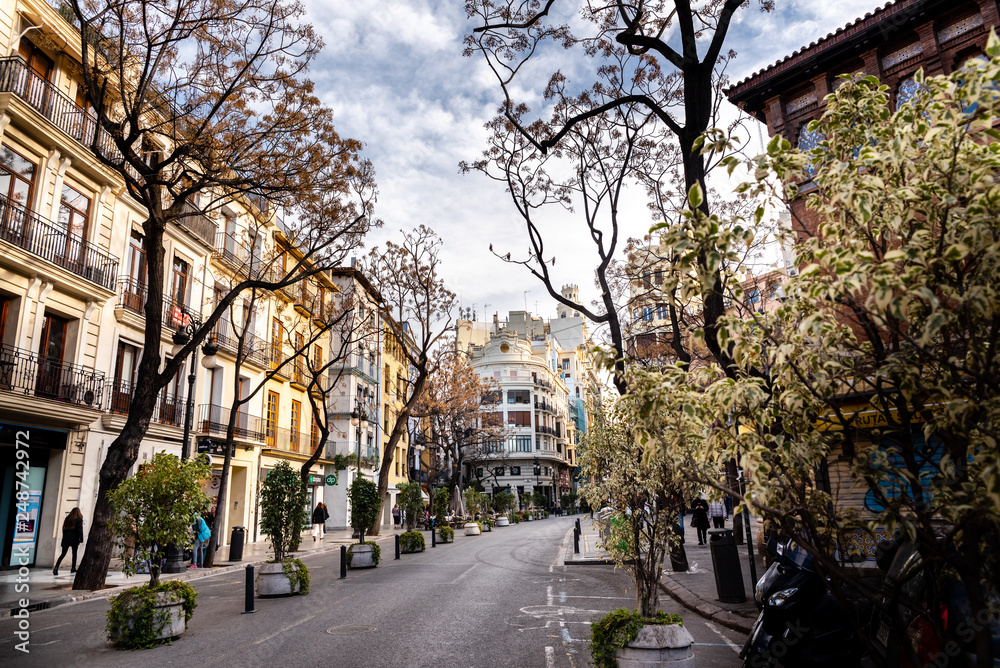 Valencia, Spain - 10 de febrero 2019:  Panoramic view of María Cristina street, in the center of the tourist city of Valencia, next to the Silk Exchange and the central market.