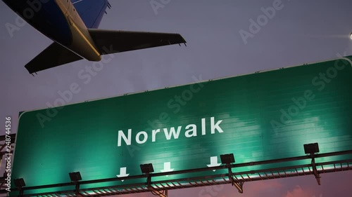 Airplane Take off Norwalk during a wonderful sunset photo