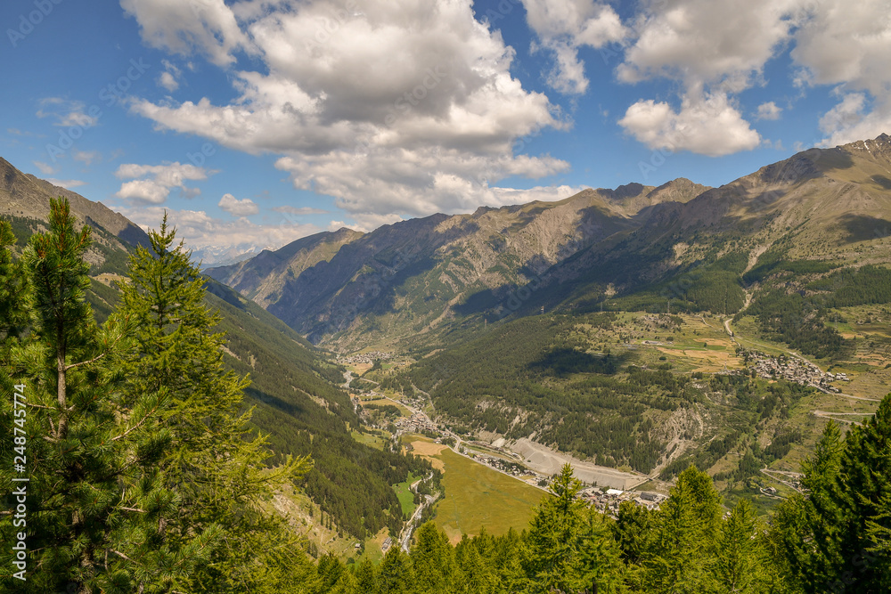 Elevated view of mountains and valleys with green forest  in Italian Alps, Cogne, Aosta Valley, Italy