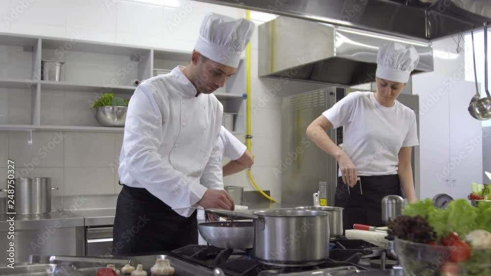 chef cooking then watching mobile phone chef cooking then watching mobile phone