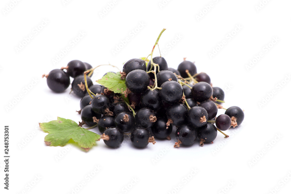 A handful of black currants on a white background. Isolated A handful of black currants on a white background. Isolated