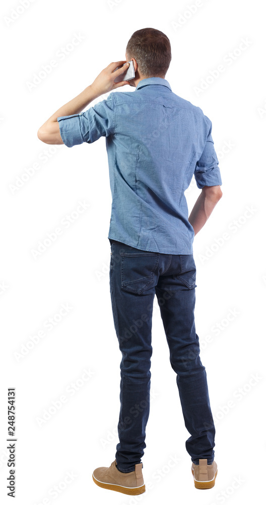 back view of a man talking on the phone back view of a man talking on the phone