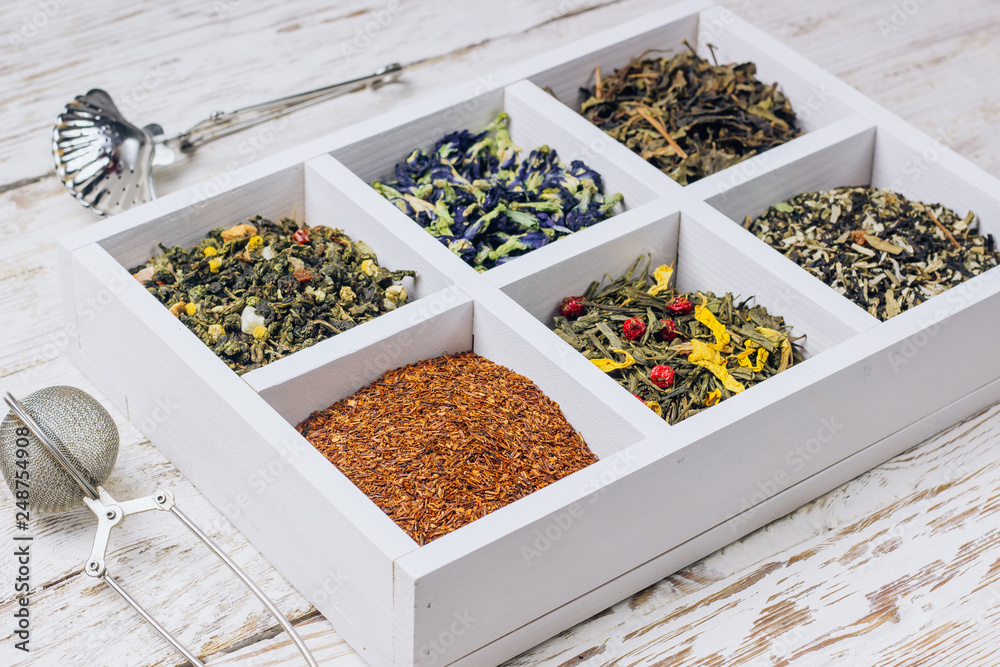 Assortment of dry tea in white wooden box. Assortment of dry tea in white wooden box.
