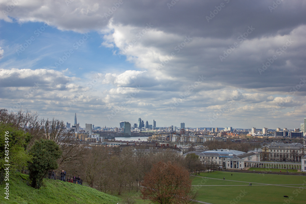 View from Greenwich over the National Maritime Museum and the skyline of London in the Background
