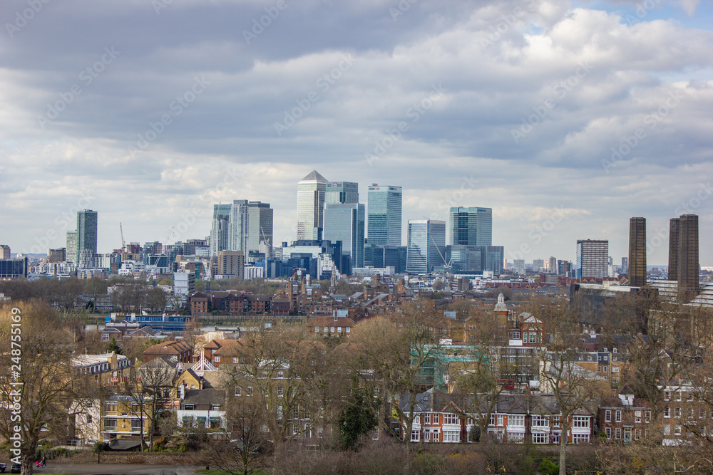 View from Greenwich over the National Maritime Museum and the skyline of London in the Background