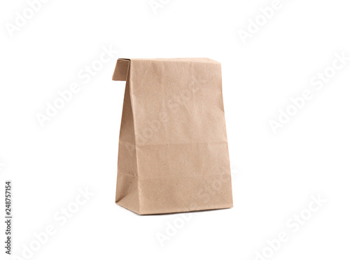 Paper brown bag for goods. Isolate. Studio photography