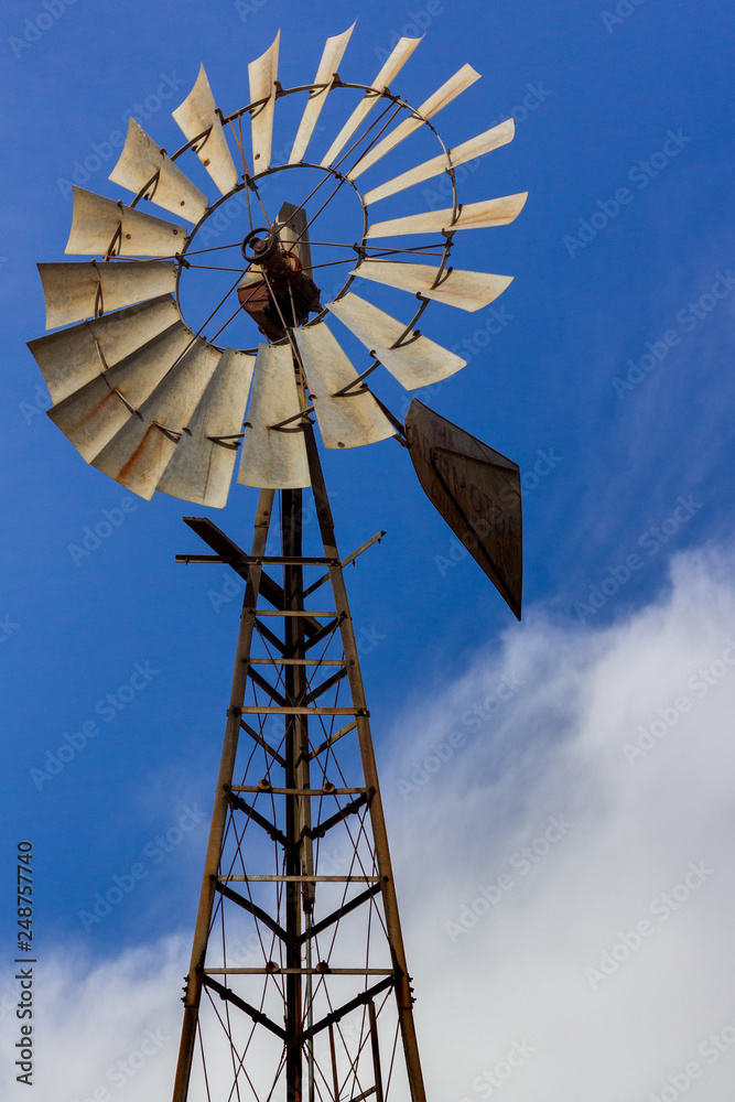 Windmill against a blue sky background