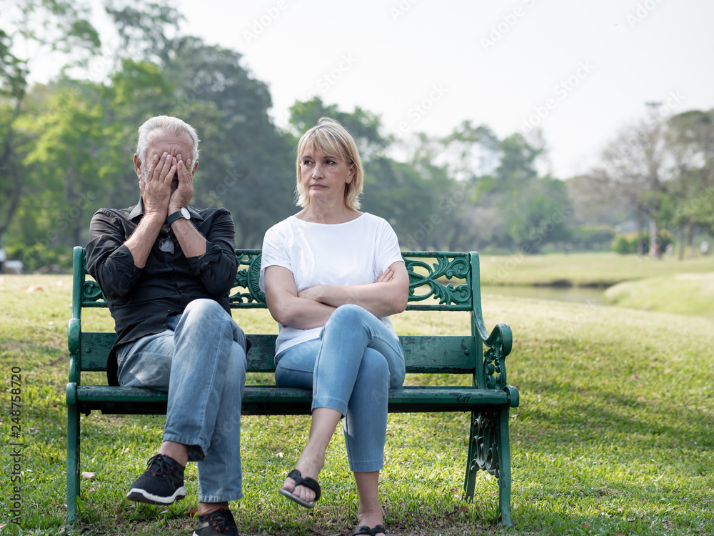 Senior couple having problem, conflict, sadness, do not understand in a park. Senior couple having problem, conflict, sadness, do not understand in a park.