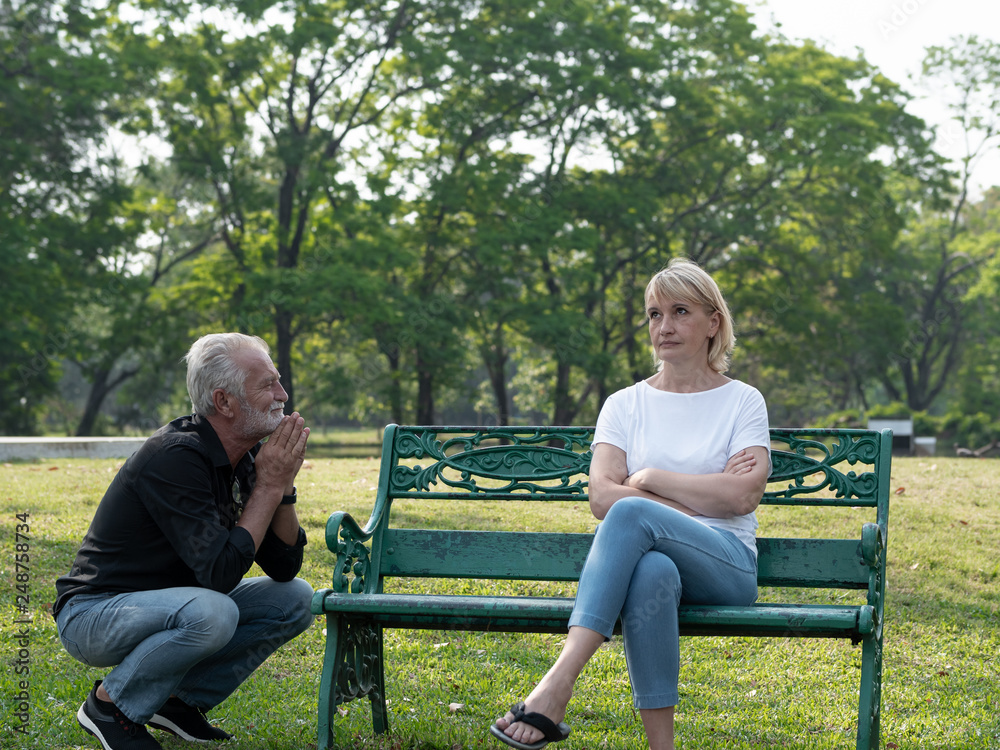 Senior couple having problem, conflict, sadness, do not understand in a park. Senior couple having problem, conflict, sadness, do not understand in a park.