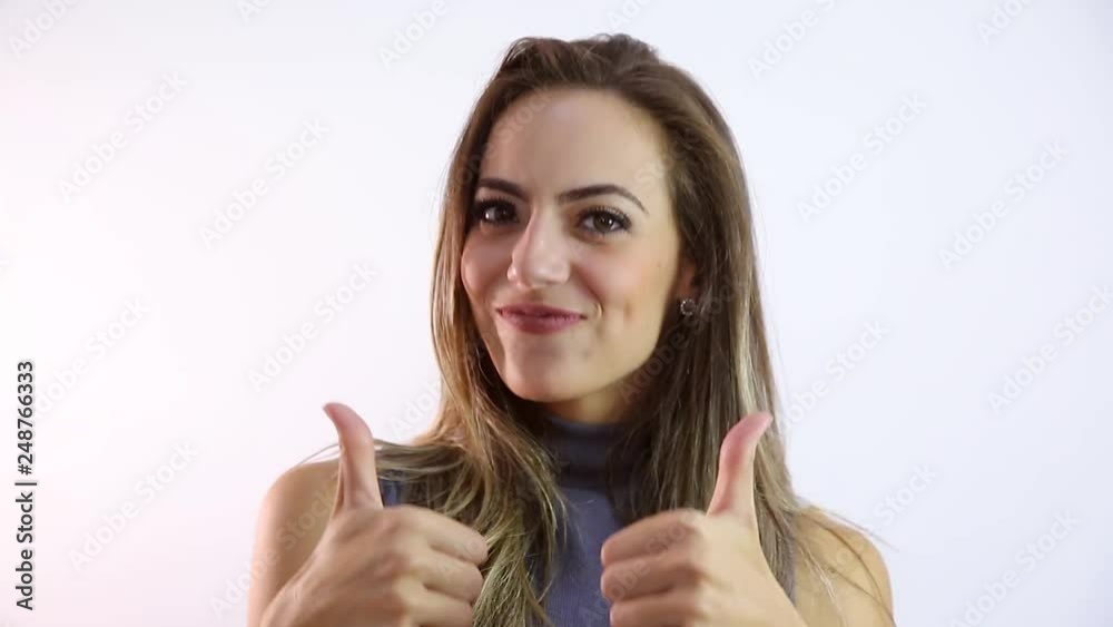 Happy beautiful caucasian woman showing thumb up. Approved. Happy beautiful caucasian woman showing thumb up. Approved.
