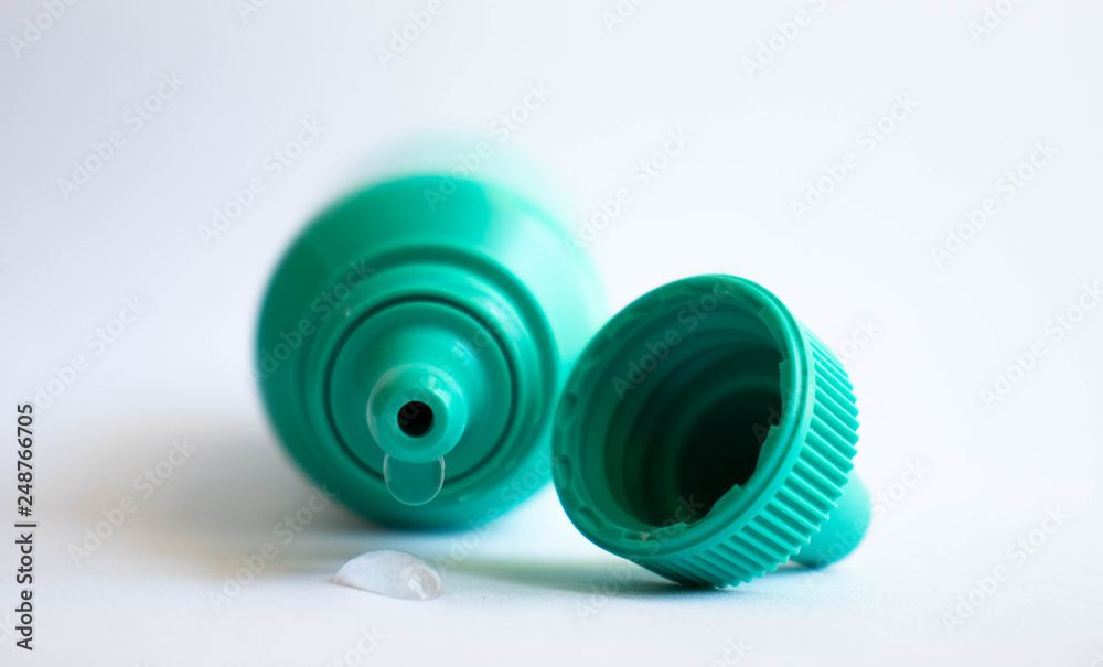 Green plastic eye dropper bottle isolated on white background. Green plastic eye dropper bottle isolated on white background.