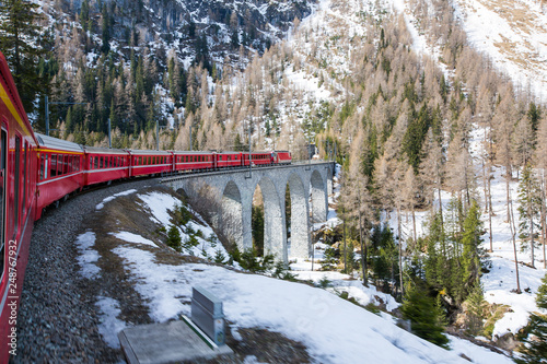 Bernina Express is passing the viaduct - Switzerland photo