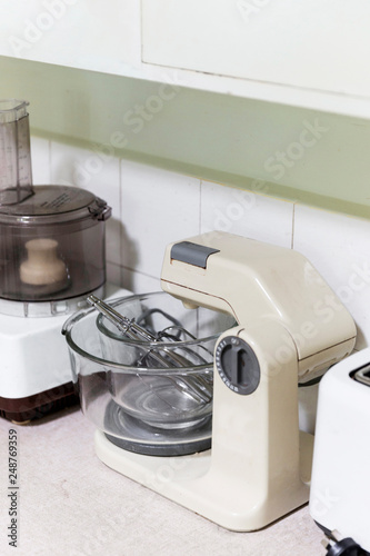 Retro cake mixer sitting stationary on bench top.