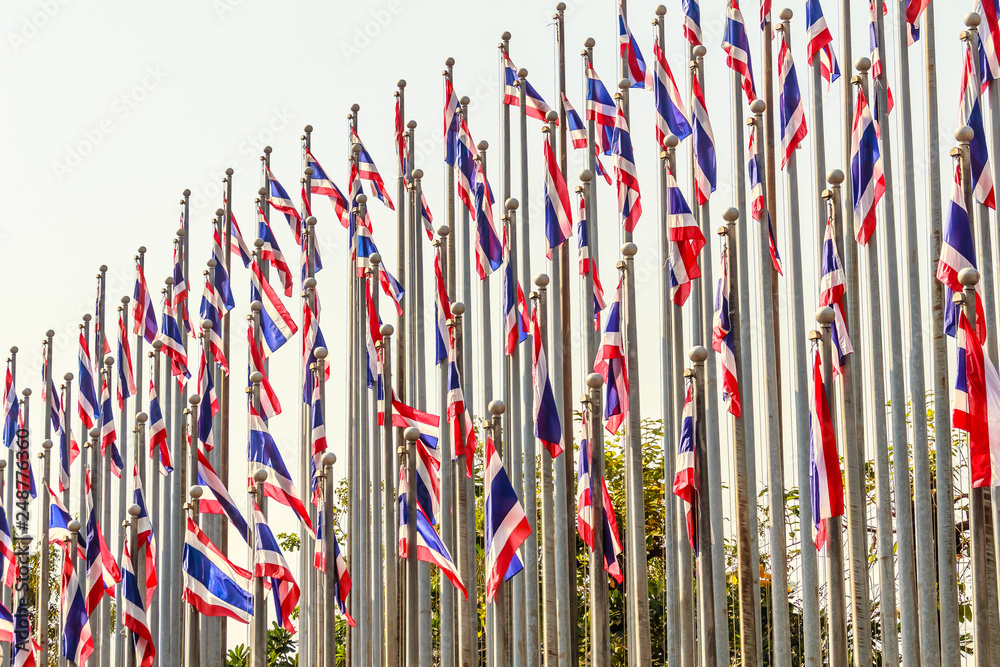 Beautiful view of Thai national flags on the poles at the Queen Sirikit National Convention Center in Bangkok, Thailand. Beautiful view of Thai national flags on the poles at the Queen Sirikit National Convention Center in Bangkok, Thailand.