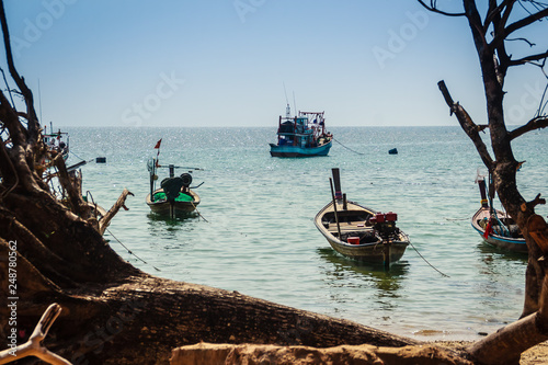 Beautiful view of fisherman boats moored on the beach of fisherman village at Naiyang beach, Phuket, Thailand.