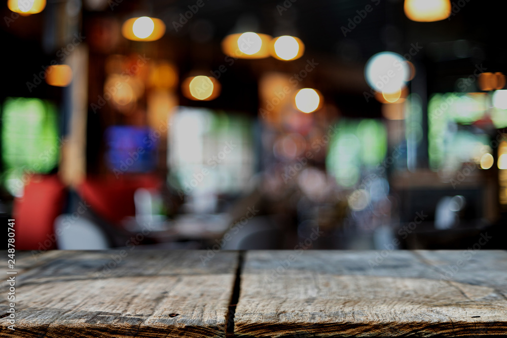 wooden table in front of the blur background