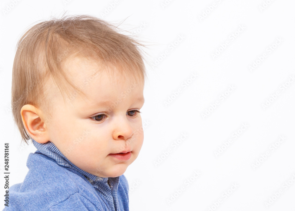 Portrait of smiling little baby boy, white background, copy space for text