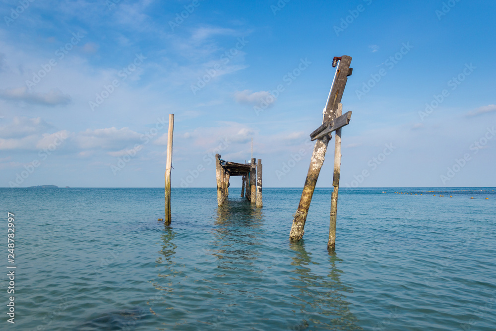 Wooen jetty was abandoned. Located by the beach Stretching into the sea. Wooen jetty was abandoned. Located by the beach Stretching into the sea.