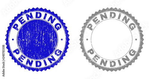 Grunge PENDING stamp seals isolated on a white background. Rosette seals with grunge texture in blue and grey colors. Vector rubber stamp imitation of PENDING label inside round rosette.