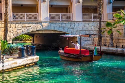 Dubai, UAE - November 29, 2018: Area Hotel Jumeirah Al Qasr. Built in the style of the summer residence of the sheikh. Located on a private beach, in a spacious area with landscaped gardens. photo