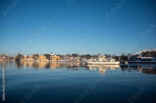 A cold winter  day in Stockholm with snow and ice on islands and boats © Hans Baath