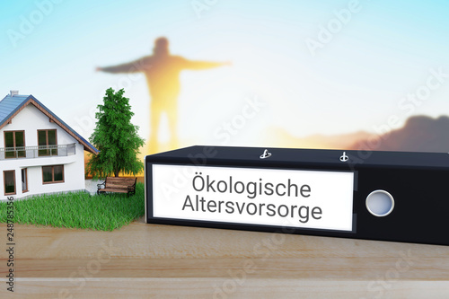 Grüne Fonds. Ordner beschriftet mit den Wörtern Ökologische Altersvorsorge liegt neben einem Haus-Modell auf einem Schreibtisch. Silhouette und Sonnenuntergang im Hintergrund. photo