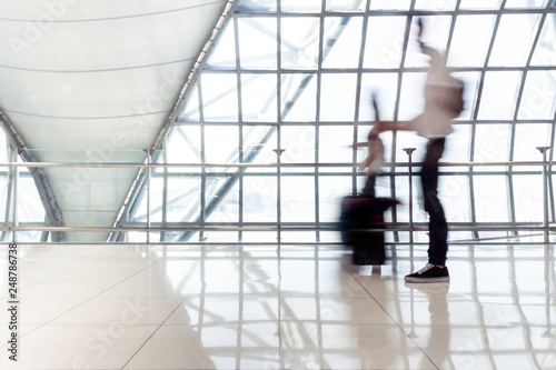 Motion blur of Passengers walk in gate of airport to boarding an airplane.