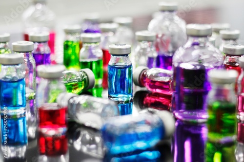 Many of colorful liquid medicine vial glass for experiment in Pharmaceutical Laboratory.