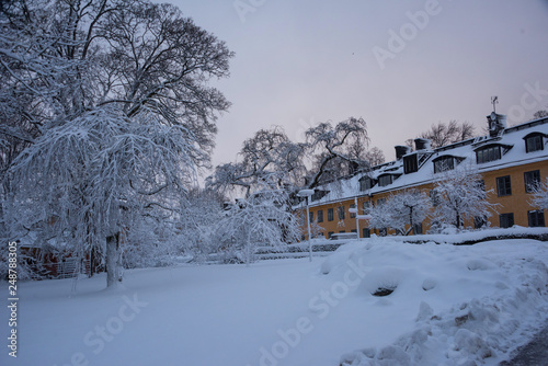 Houses and snow on the Skeppsholmen island i Stockholm a gray winter day
