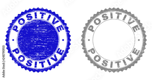 Grunge POSITIVE watermarks isolated on a white background. Rosette seals with grunge texture in blue and gray colors. Vector rubber stamp imitation of POSITIVE text inside round rosette.