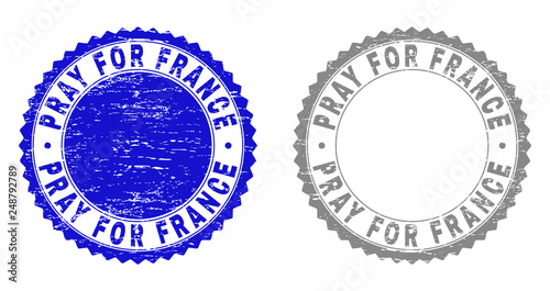 Grunge PRAY FOR FRANCE stamp seals isolated on a white background. Rosette seals with grunge texture in blue and grey colors.