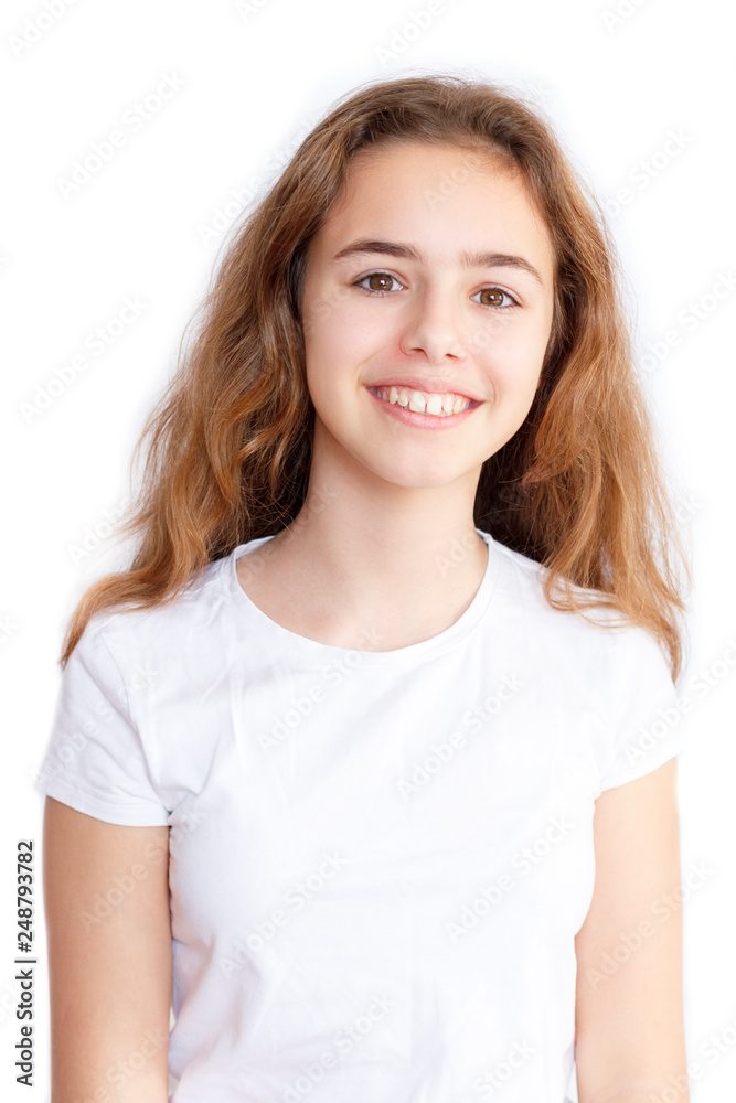 Beautiful teen girl in white t-shirt smiling at camera Beautiful teen girl in white t-shirt smiling at camera