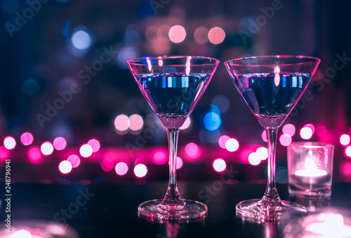 pair of cocktail glasses on restaurant bar
