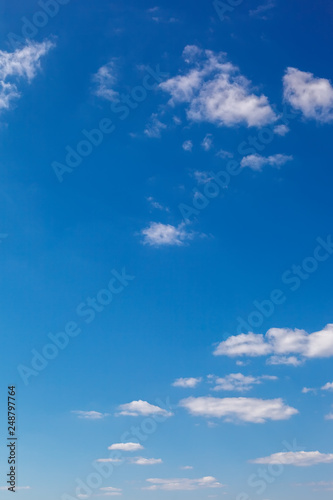 Blue sky with white clouds as a background