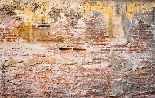 Cracked concrete vintage wall background, old brick wall