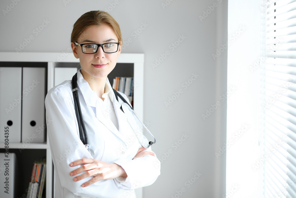 Doctor woman at work. Portrait of female physician at hospital office. Medicine and healthcare concept Doctor woman at work. Portrait of female physician at hospital office. Medicine and healthcare concept