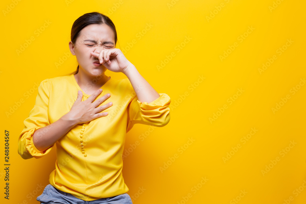 Woman use tissue paper after she sneezing Woman use tissue paper after she sneezing