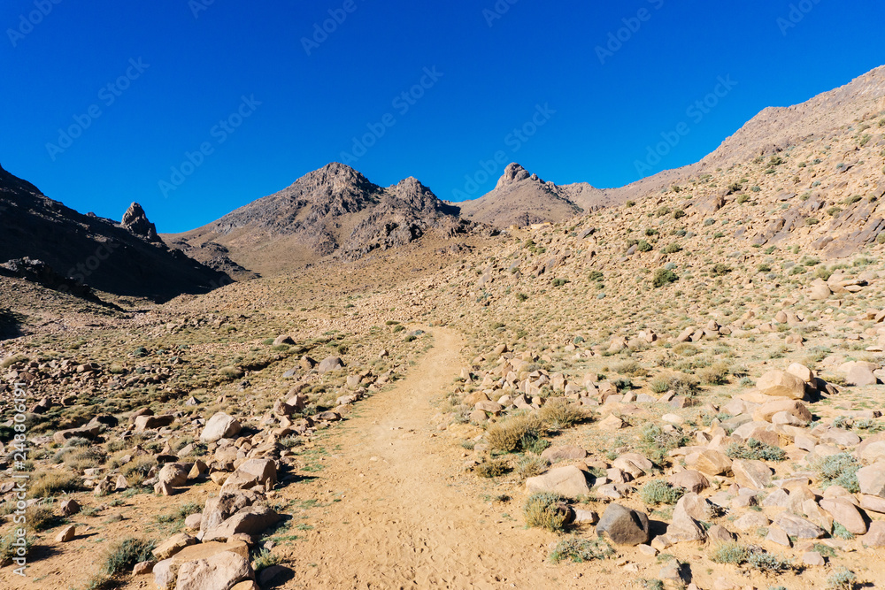 Morocco tourism: trekking man in mountains. Atlas mountains, Jebel Sakhro (Djebel Sahro), Ourzazate, Morocco
